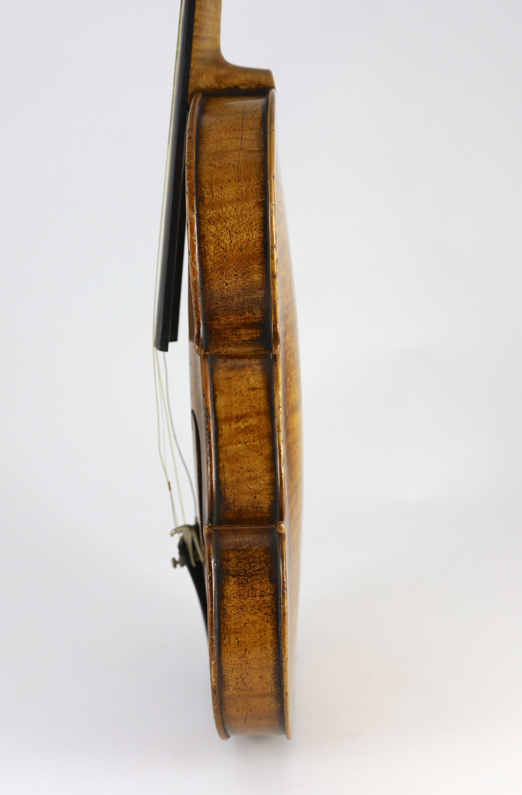 A 19th century violin, degraded internal paper label reads ‘Amati’, back measurement 36cm